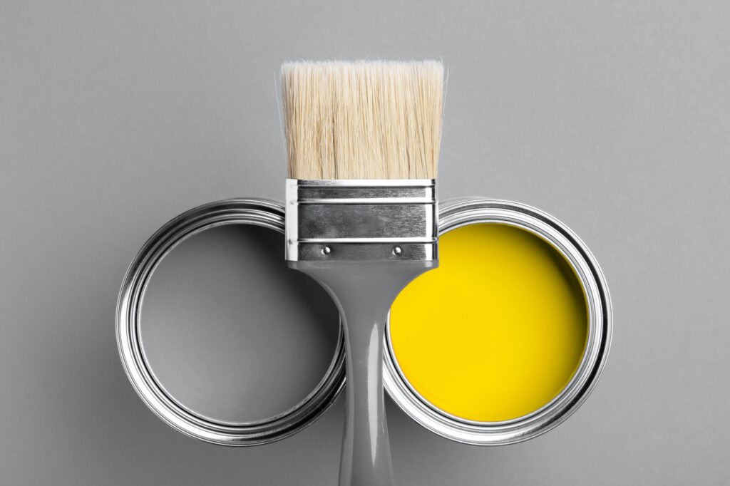 Gray and Yellow Paints with Gray Paintbrush.